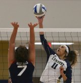 West Hills College Lemoore's Courtney Anaya goes head to head with West Hills Coalinga's Isabella Galang in Wednesday's first-ever West Hills Coalinga vs. Lemoore volleyball match.